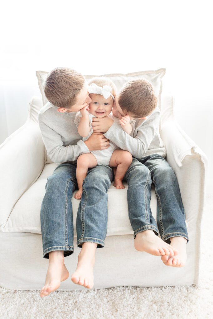 Baby girl with big brothers at Studio Neue, by Brooke Leigh Photography, a Plymouth Michigan Newborn Photographer