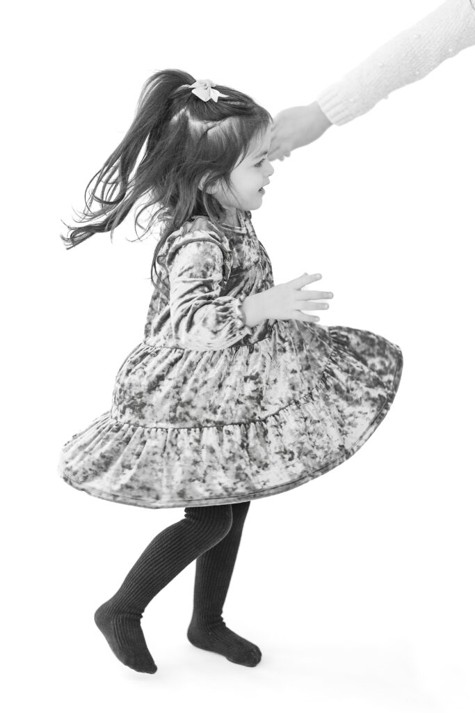 Studio Neue hosts Little sister dancing for her Personality Mini Session put on by Plymouth Michigan Newborn Photogapher